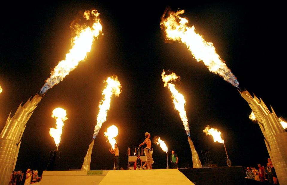 A fire dancer performs on the dry lake bed at the Burning Man festival in August 2008 in the Black Rock Desert near Gerlach, Nevada. <a href="https://newsroom.ap.org/detail/BurningMan/d4c60da005944c42a753d8fd9874006b/photo?Query=burning%20man%20nevada&mediaType=photo&sortBy=&dateRange=Anytime&totalCount=108&currentItemNo=40" rel="nofollow noopener" target="_blank" data-ylk="slk:AP Photo/Brad Horn;elm:context_link;itc:0;sec:content-canvas" class="link ">AP Photo/Brad Horn</a>