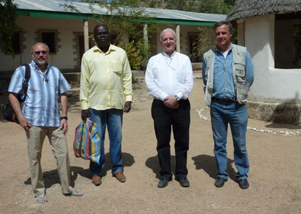 This photo released by Vicenza Diocesi, Saturday April 5, 2014 shows Vicenza Bishop Beniamino Pizziol, second from right, flanked by father Gianantonio Alllegri, left, and Giampaolo Marta, right, during a visit in Jericho, near Maroua, Cameroon, on Jan. 2014. Officials say two Italian priests and a Canadian nun working as missionaries in northern Cameroon have been abducted. Italy's foreign ministry said the abduction occurred during the night between Friday and Saturday about 30 kilometers (20 miles) from the border with Nigeria. It identified the priests as Giampaolo Marta and Gianantonio Allegri, but declined to give other details, including the Canadian's identity, to avoid compromising efforts for the missionaries' release.( AP Photo/Vicenza Diocese)