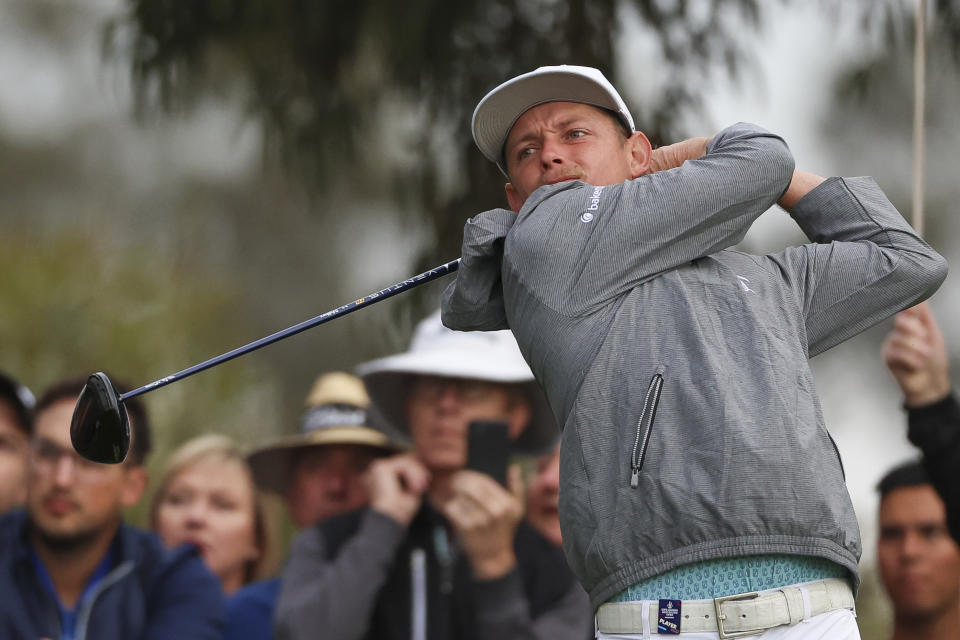 Australia's Cameron Smith tees off on the 12th hole during the Australian Open golf championship at Kingston Heath golf course in Melbourne, Australia, Friday, Dec. 2, 2022. (AP Photo/Asanka Brendon Ratnayake)