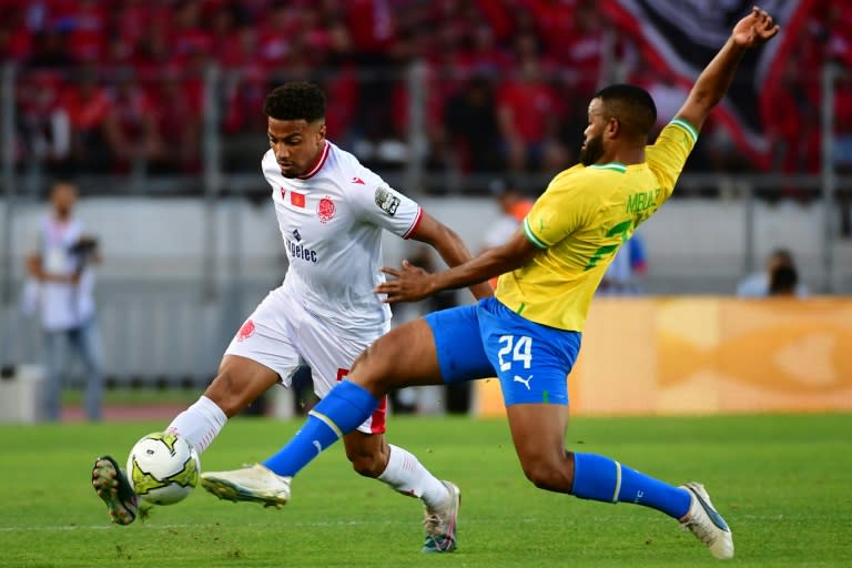 Wydad Casablanca defender Ayoub el Amloud (L) and Mamelodi Sundowns midfielder Sipho Mbule clash during a CAF Champions League semi-final first leg in Morocco.