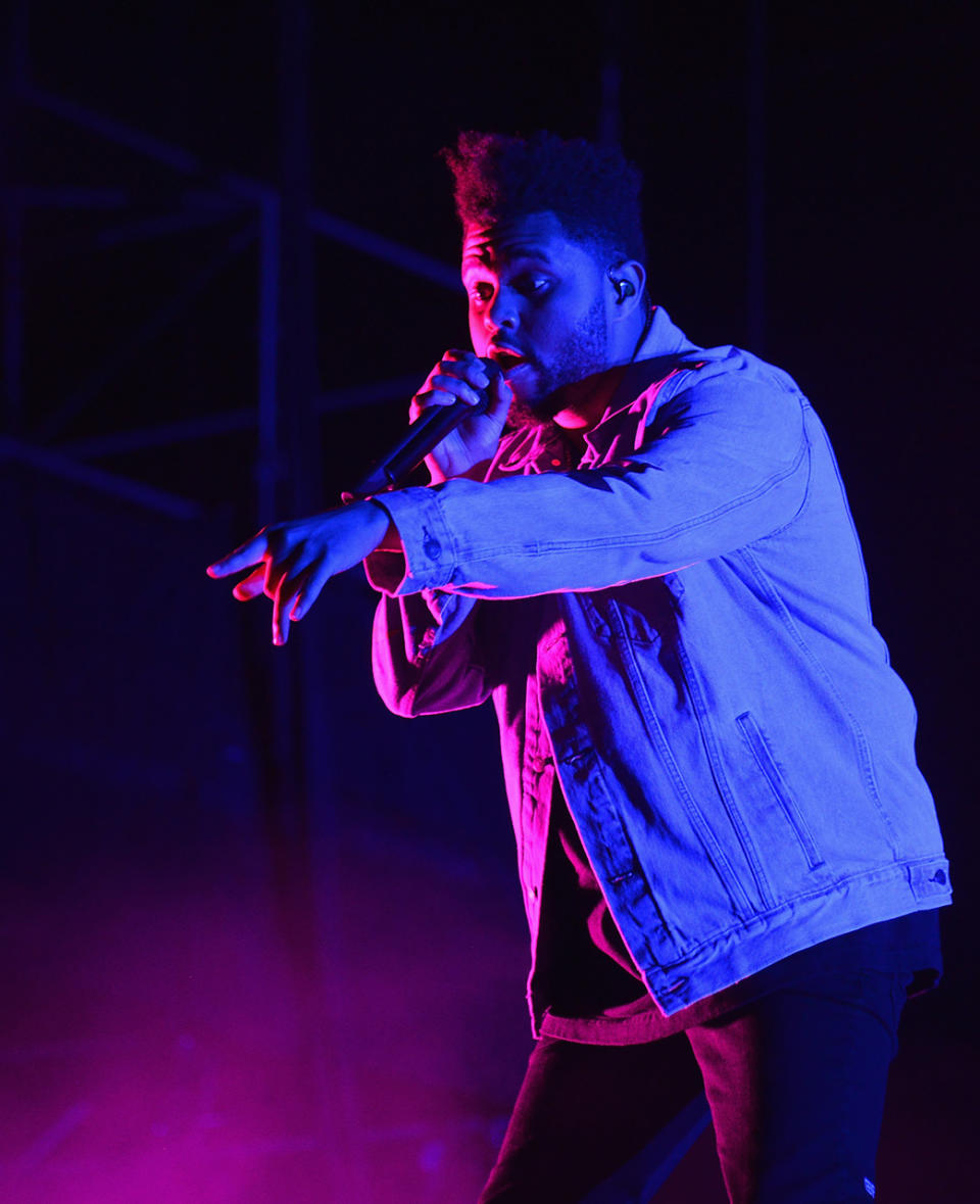 <p>The Weeknd performs onstage during the 2017 Firefly Music Festival on June 17, 2017 in Dover, Delaware. (Photo by Kevin Mazur/Getty Images for Firefly) </p>