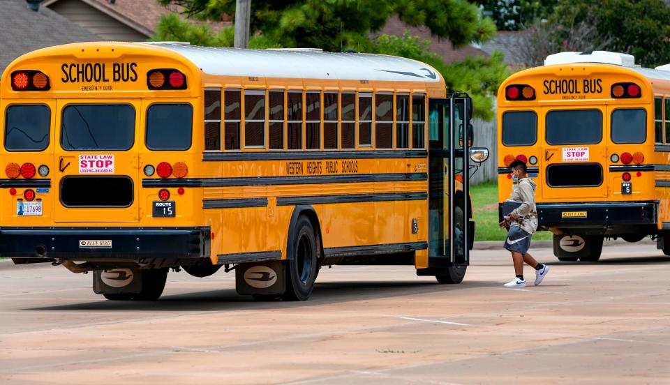 A Western Heights Middle School student gets on a bus Aug. 18 after the first day of school in the Western Heights school district in Oklahoma City.