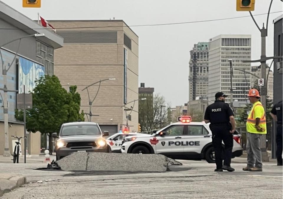 A view of a large hole in the roadway at University Avenue West and Church Street in downtown Windsor on April 29, 2024.