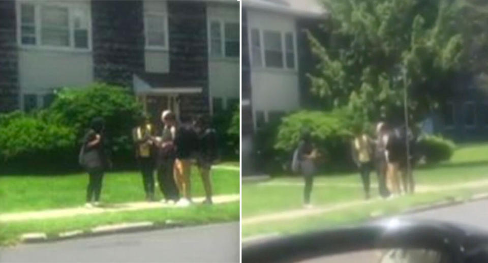 Mobile phone vision shows the teens helping the elderly man on the footpath.