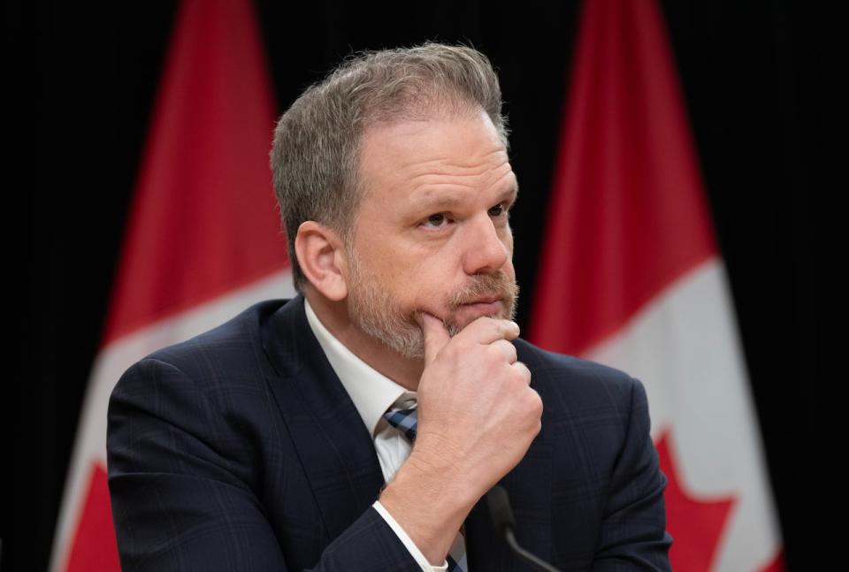 Health Minister Mark Holland listens to a question from a reporter during a news conference, Tuesday, December 12, 2023 in Ottawa.
