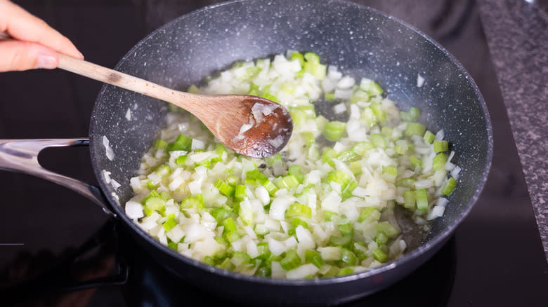 vegetables sauteeing in pan 