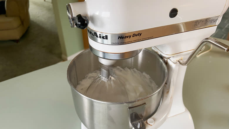 Stiffly beaten egg whites in stand mixer bowl