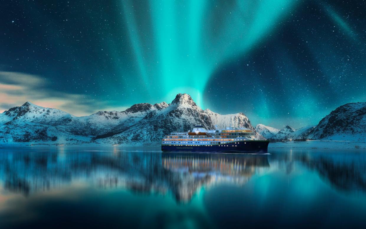 Havila ship bathed in Northern Lights - Havila Voyages