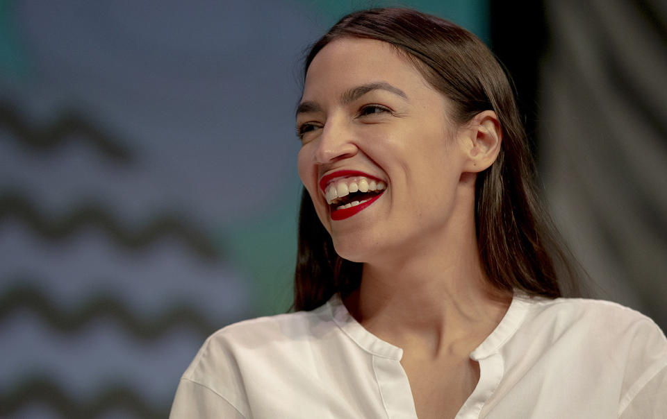 Rep. Alexandria Ocasio-Cortez, D-New York, laughs during South by Southwest on Saturday, March 9, 2019, in Austin, Texas. The festival has grown from obscure roots into a weeklong juggernaut of tech, politics and entertainment. (Nick Wagner/Austin American-Statesman via AP)