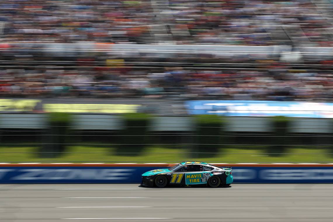 Jul 14, 2024; Long Pond, Pennsylvania, USA; NASCAR Cup Series driver Denny Hamlin (11) races during The Great American Getaway 400 at Pocono Raceway.