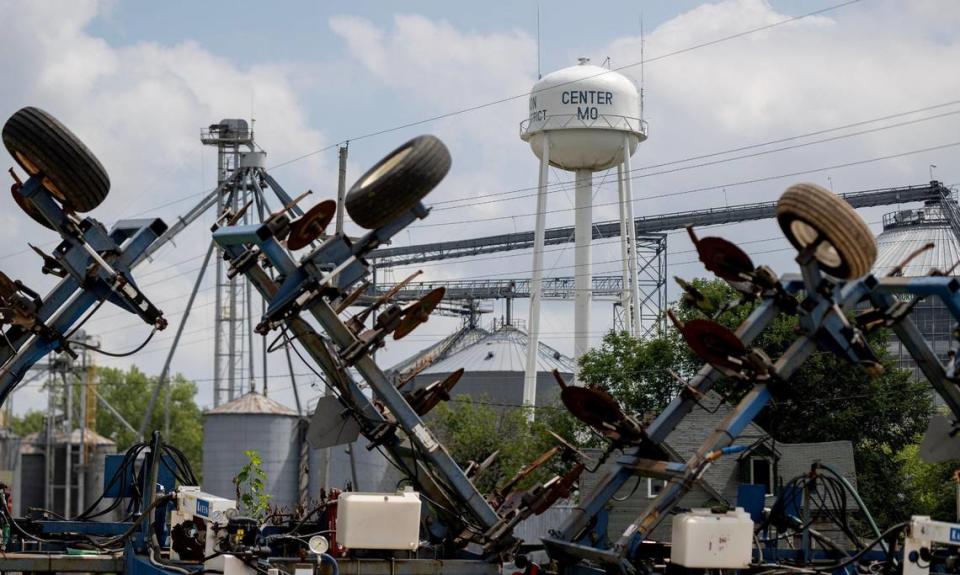 A disc harrow in the foreground with Center, Missouri, water tower in the background. As the city clerk of Center, Missouri, Tracey Carman stole at least $316,887 during her time at City Hall.