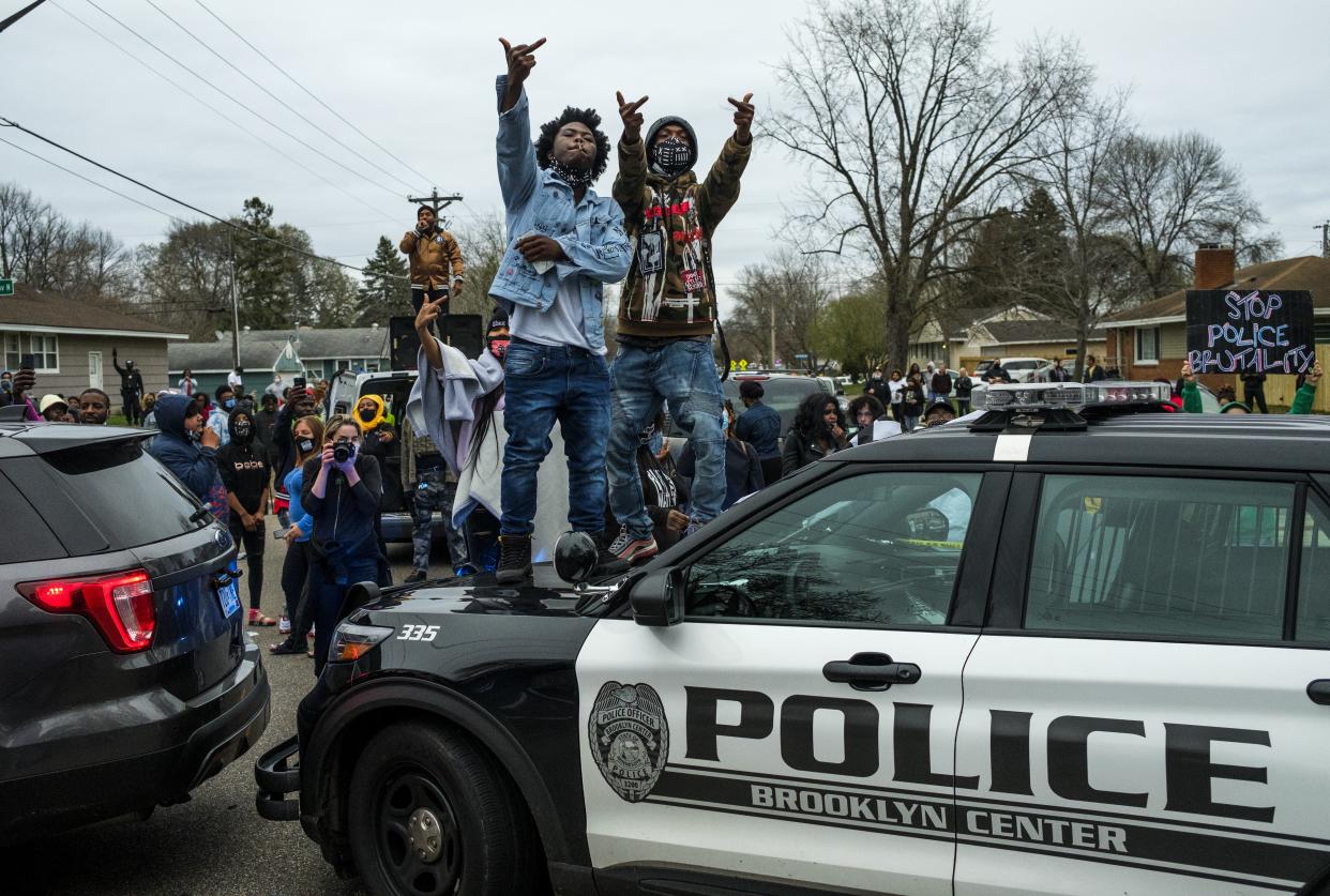 <p>People stand on a police cruiser as protesters take to the streets after Brooklyn Center police shot and killed Daunte Wright during a traffic stop on April 11, 2021 in Brooklyn Center, Minnesota.</p> (Photo by Stephen Maturen/Getty Images)