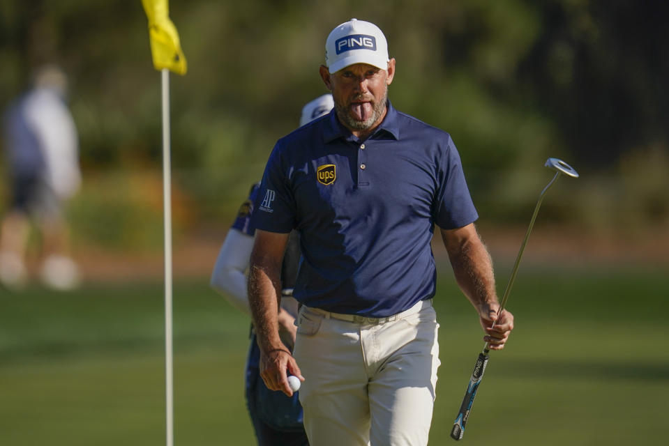 Lee Westwood, of England, reacts after making a putt on the 16th hole during the final round of The Players Championship golf tournament Sunday, March 14, 2021, in Ponte Vedra Beach, Fla. (AP Photo/Gerald Herbert)
