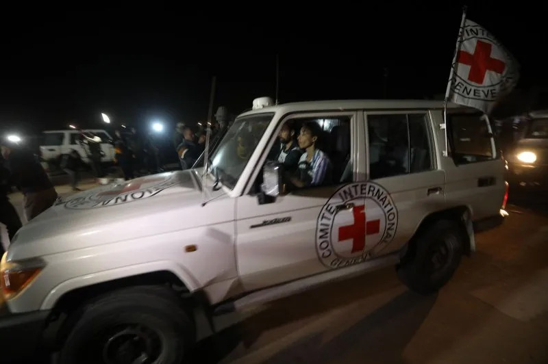 An International Red Cross vehicle carrying Israeli Russian hostage Ron Krivoy released by Hamas drives towards the Rafah border point with Egypt ahead of a transfer to Israel, on Sunday, November 26, 2023. The Israeli army said, that 13 released hostages in northern Gaza City were back on Israeli territory, and another four were on their way via the Rafah crossing between the Gaza Strip and Egypt. 
 Photo by Ismail Muhammad/UPI