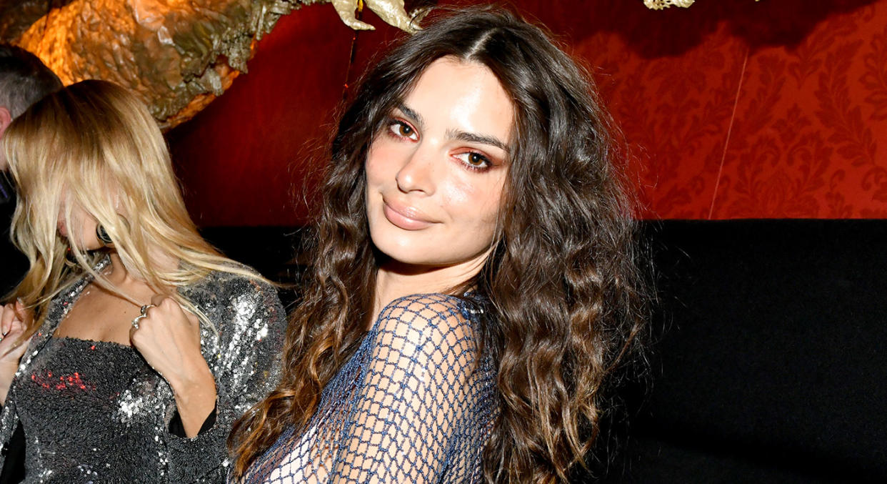 Emily Ratajkowski wore the gemmed fishnet dress at a party on Wednesday. (Getty Images)