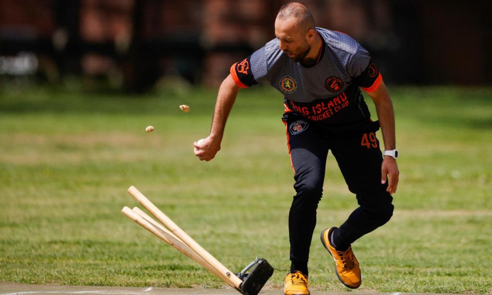 <span>A player from Long Island United Cricket Club in action at Eisenhower Park in New York.</span><span>Photograph: Kena Betancur/AFP/Getty Images</span>