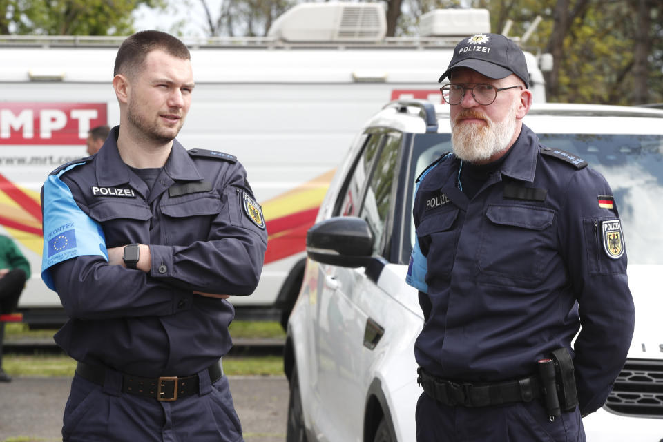 German members of Frontex Standing Corps talk to each other prior the official launch of the Frontex Joint Operation in North Macedonia, at police barracks in Skopje, North Macedonia, on Thursday, April 20. 2023. (AP Photo/Boris Grdanoski)