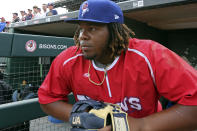 FILE - In this July 31, 2018, file photo, Toronto Blue Jays top prospect third baseman Vladimir Guerrero Jr. looks on before a minor league baseball with the Buffalo Bisons against the Lehigh Valley IronPigs in Buffalo, N.Y. The displaced Toronto Blue Jays will play in Buffalo, New York, this year amid the pandemic. An official familiar with the matter told The Associated Press on Friday that the Blue Jays will play at Sahlen Field. The official spoke on condition of anonymity as they were not authorized to speak publicly ahead of an announcement. (AP Photo/Jeffrey T. Barnes, File)