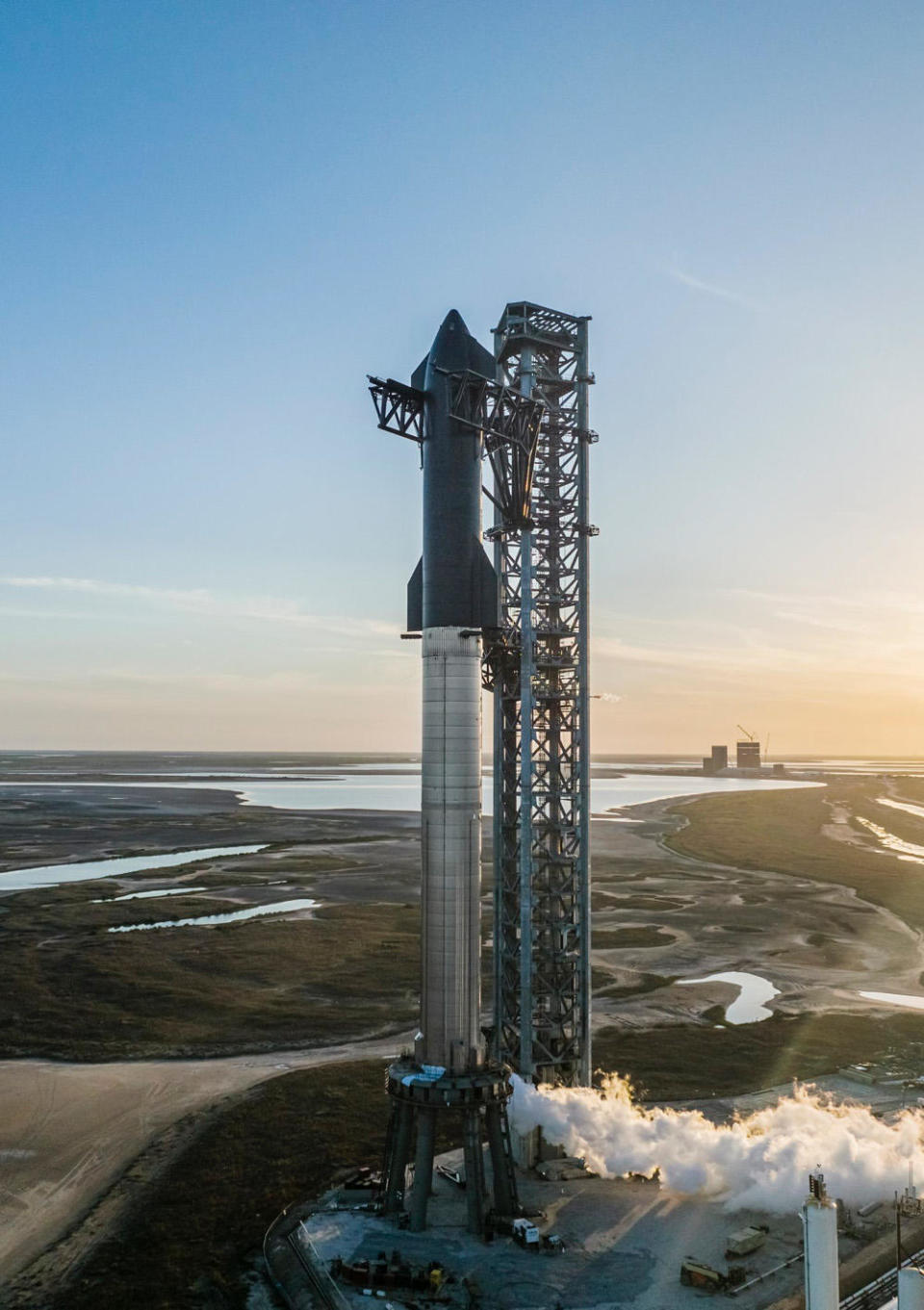 The Starship-Super Heavy launch vehicle, seen here during propellant loading tests, stands 400 feet tall and measures 30 feet wide. It is the largest, most powerful rocket ever built. SpaceX hopes to launch the huge booster on its first test flight to orbit later this year. / Credit: SpaceX