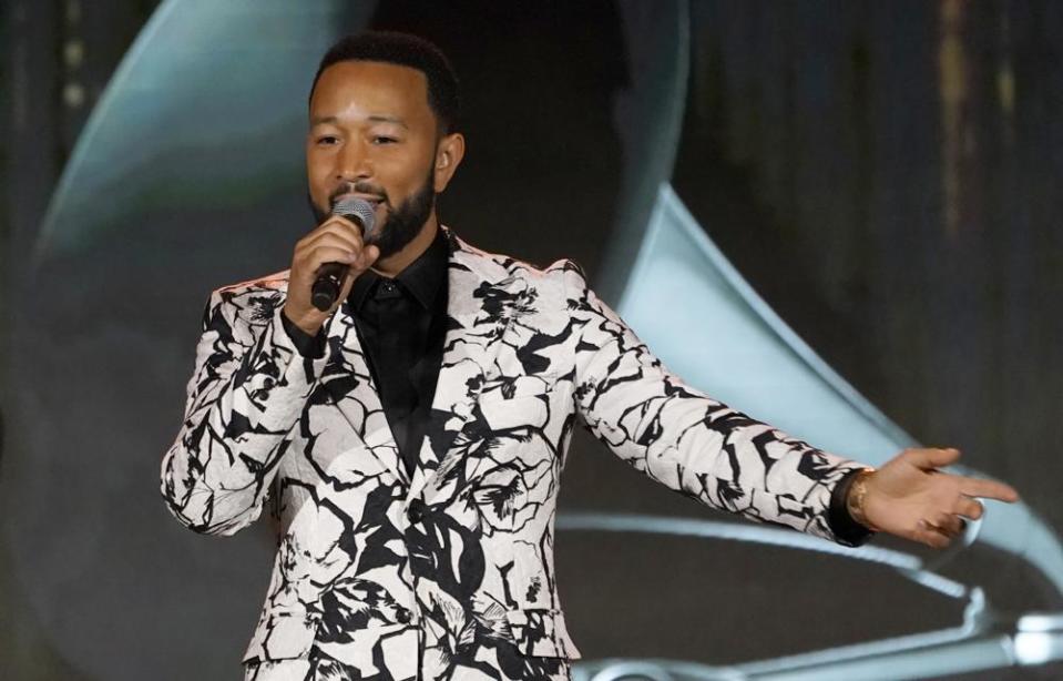 John Legend accepts the Global Impact Award on April 2, 2022 at the Recording Academy Honors Presented By The Black Music Collective at Resorts World Las Vegas. Legend, who announced the date for his forthcoming album, is currently performing in Las Vegas in the show, “Love in Las Vegas,” at the Zappos Theater at Planet Hollywood. (AP Photo/Chris Pizzello)