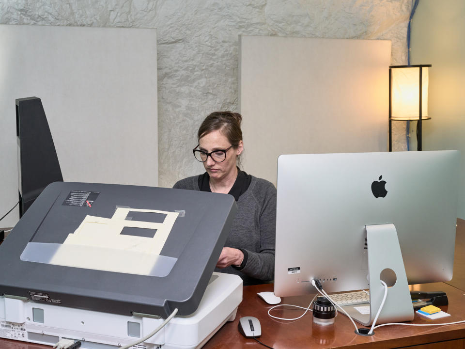 Stauffer looks at a negative she recently pulled for scanning.