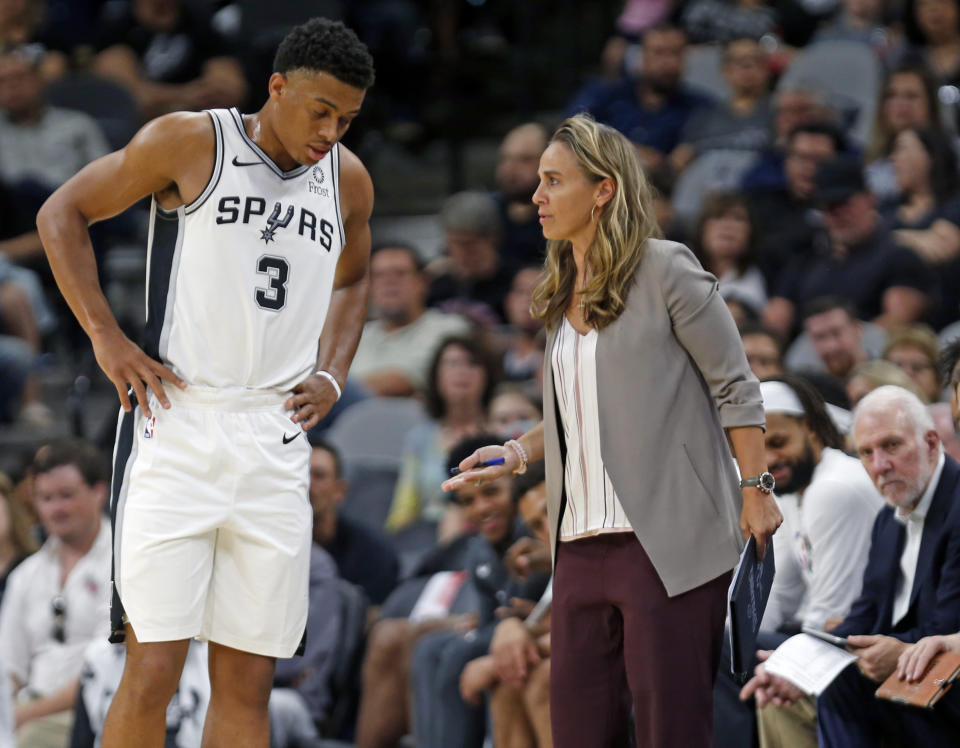 Carrie Taylor coached the Mount St. Joseph University men's soccer team over a decade ago, well before women like San Antonio Spurs assistant Becky Hammon (right) blazed their own trails. (Photo by Ronald Cortes/Getty Images)