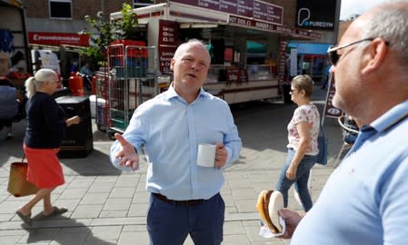 Conservative MP Royston Smith talks to members of the public in a shopping precinct in his constituency of Southampton Itchen