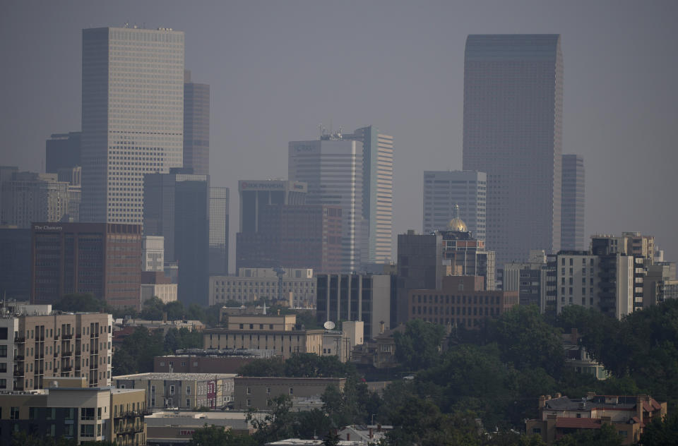 Smoke from western wildfires funnels along Colorado's Front Range and obscures the skyline Sunday, Aug. 8, 2021, in Denver. (AP Photo/David Zalubowski)