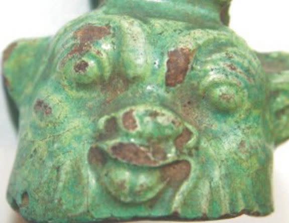 Bes, a dwarf god and protector of young children and pregnant women, is depicted in this faience bell from the first millennium B.C.