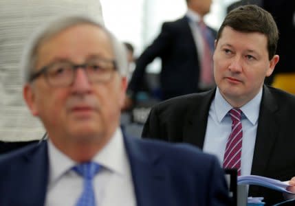 FILE PHOTO: General Secretary of the European Commission Martin Selmayr (R), sits European Commission President Jean-Claude Juncker ahead of a debate on the guidelines on the framework of future EU-UK relations at the European Parliament in Strasbourg, France, March 13, 2018.  REUTERS/Vincent Kessler