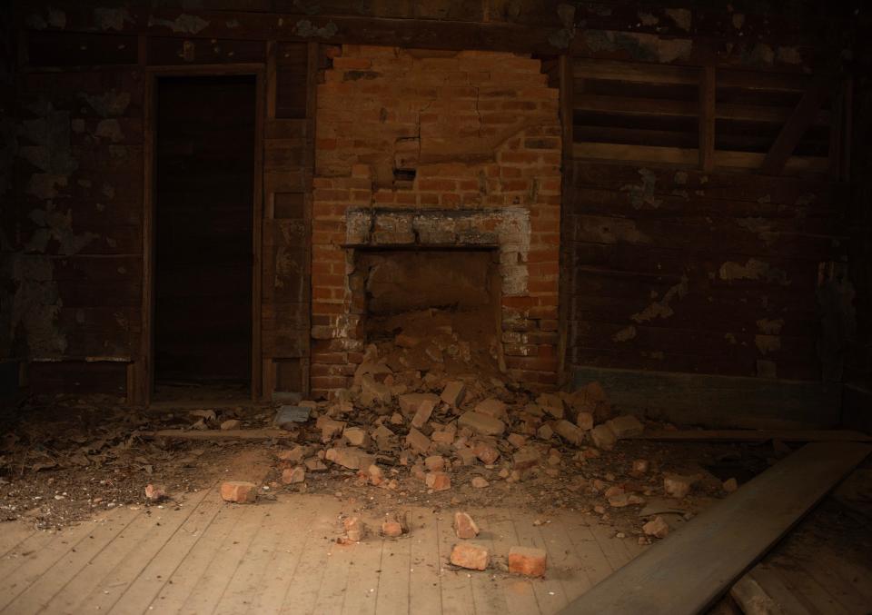 A fireplace inside a building on Greenfield Farm, previously owned by William Faulkner, which will be the site of a writers' residency set to open in 2025 near Oxford.