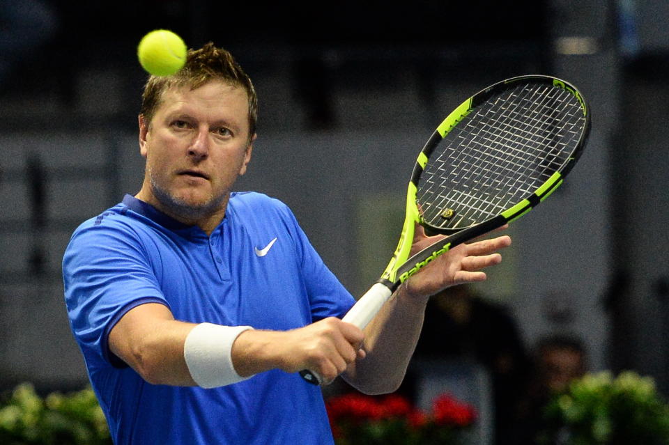 ST PETERSBURG, RUSSIA  SEPTEMBER 25, 2016: Yevgeny Kafelnikov returns the ball in a mixed doubles match as part of the tennis legends show at the 2016 St. Petersburg Open. Andrei Ivanov/TASS (Photo by Andrei Ivanov\TASS via Getty Images)