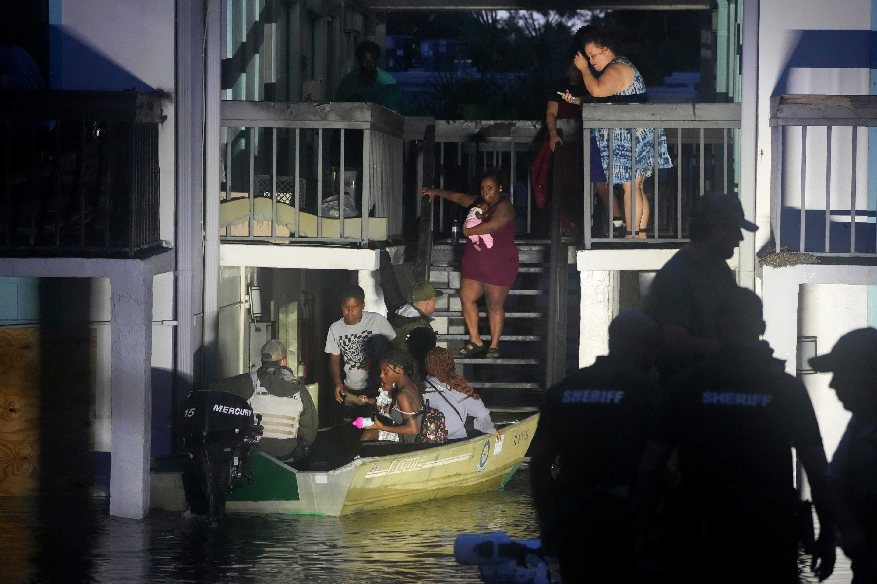 Residents are rescued from a two-story apartment complex in Clearwater. 