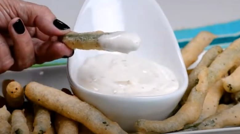 dipping fried green beans in mayo