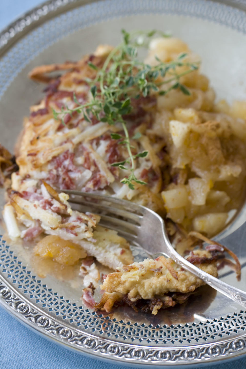 This Oct. 7, 2013 photo shows latke crusted turkey cutlet and Meyer lemon applesauce. (AP Photo/Matthew Mead)