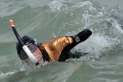 File photo of French amputee and swimmer Philippe Croizon swimming in the sea off La Rochelle. Croizon, who swam the English Channel in 2010, hopes to make four swims over the next few months; joining Oceania and Asia, Africa and Asia, Europe and Africa, and Asia to America