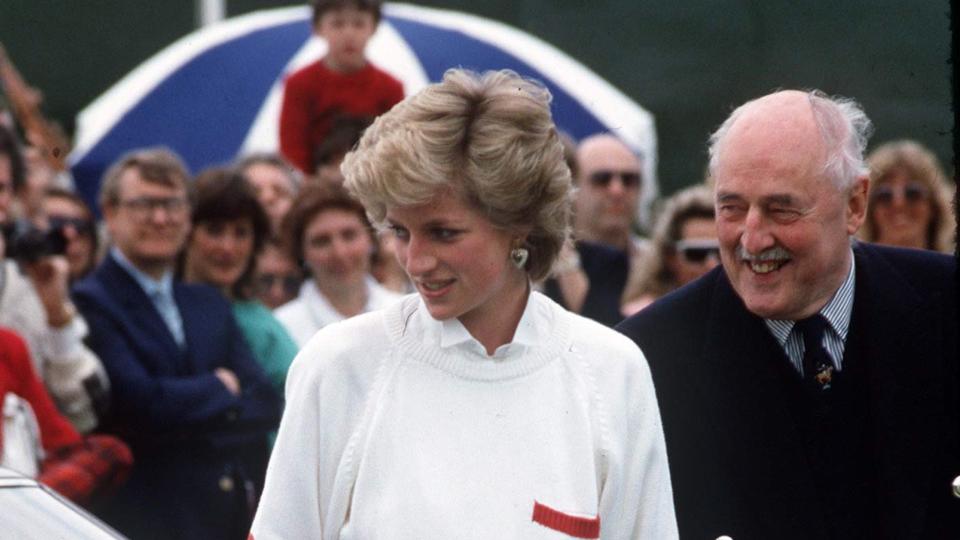 Diana, the late Princess Of Wales, wearing a pleated skirt with an oversized sweater