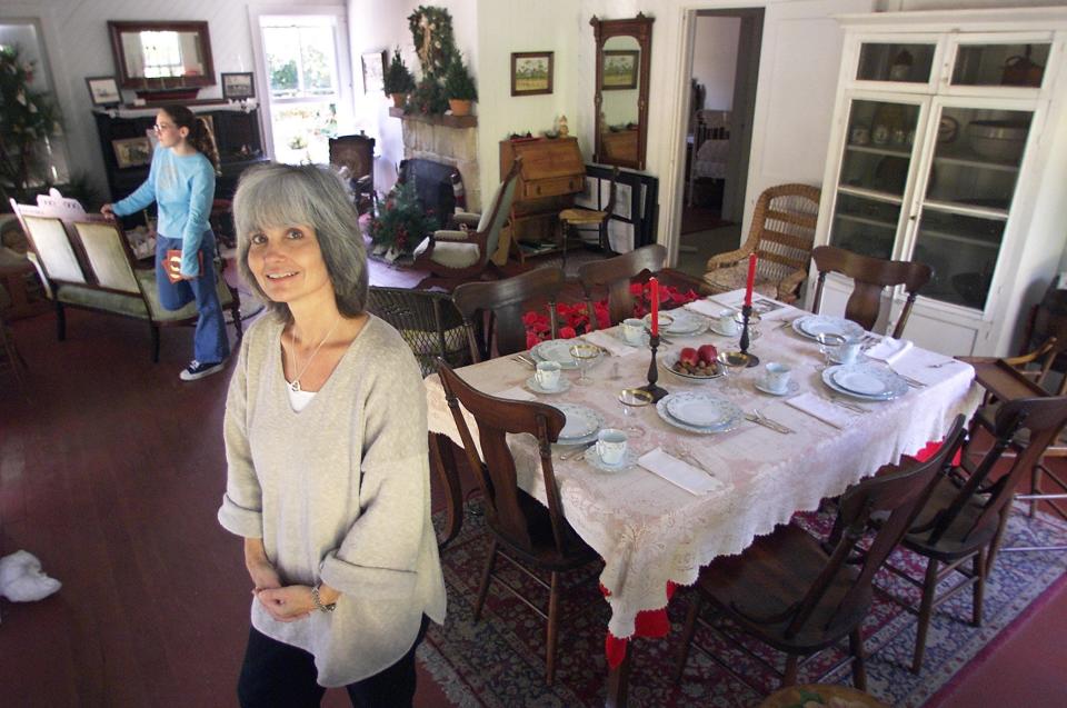 The DuBois Pioneer Home is turning 125 years old. Jamie Stuve, education curator for the Florida History Center and Museum, and volunteer Kate Melanson are seen here at the DuBois home in December 2001. The house underwent extensive renovations in the early 2000s. 'We hope to turn the home into a living village to show the school children of Palm Beach County what life was like for the pioneers,' Stuve said at the time.