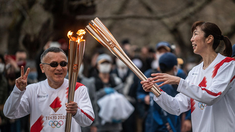 The Olympic torch relay began in March, with the Tokyo Games set to begin on July 23. (Photo by Philip FONG / AFP) (Photo by PHILIP FONG/AFP via Getty Images)