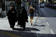 <p>Women walk at a shopping street in Istanbul, July 27, 2016. (Photo: Petros Karadjias/AP)</p>