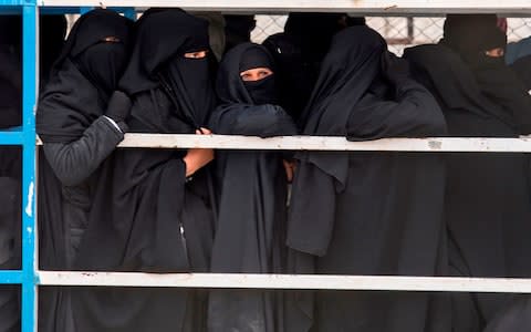 Women queue for supplies at al-Hol - Credit: AFP