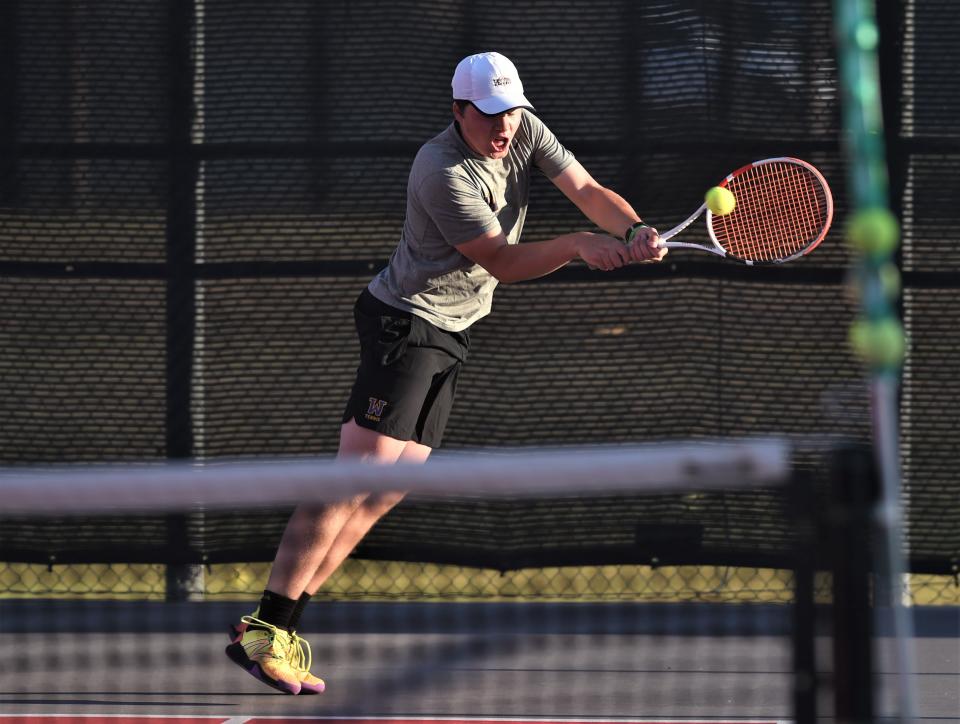 Wylie's Connor Brown chases down a shot during his boys doubles match with teammate Grant Bristow at the Region I-5A tournament Tuesday in Lubbock.