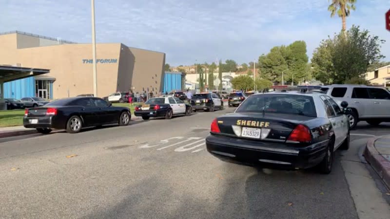 General view of first responder vehicles outside Saugus High School in Santa Clarita