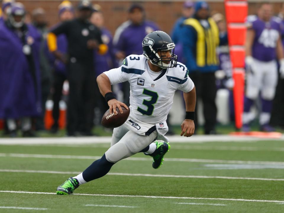 Russell Wilson rolls out during a 2015 game against the Minnesota Vikings.