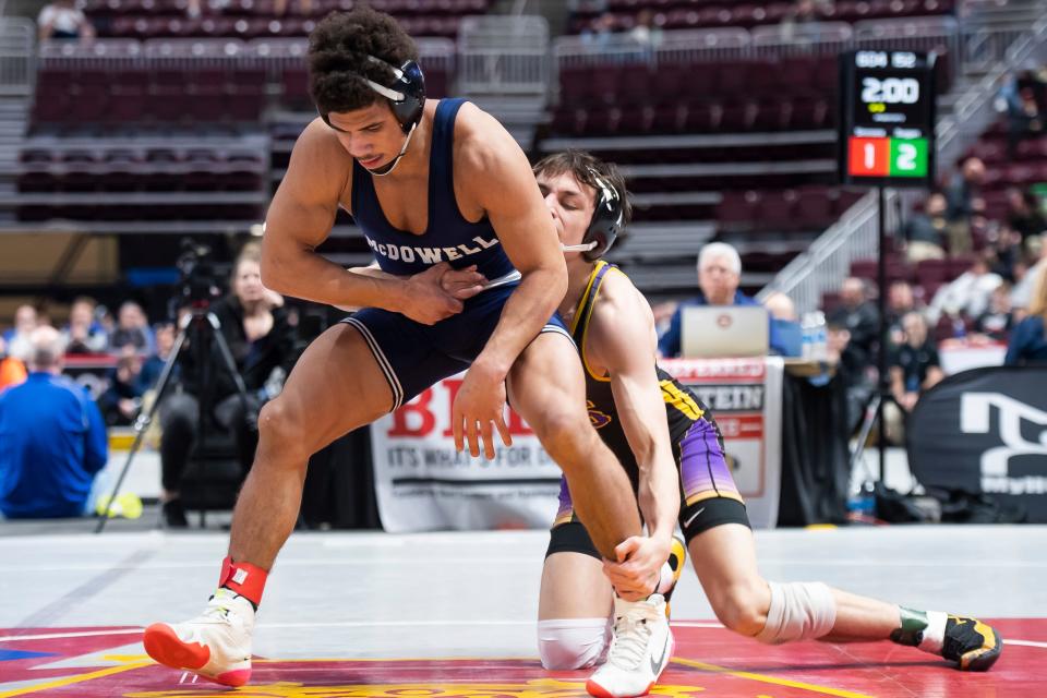 McDowell's Artis Simmons (front) wrestles Boiling Springs' Michael Duggan in a 152-pound first round bout at the PIAA Class 3A Wrestling Championships at the Giant Center on March 9, 2023, in Derry Township.