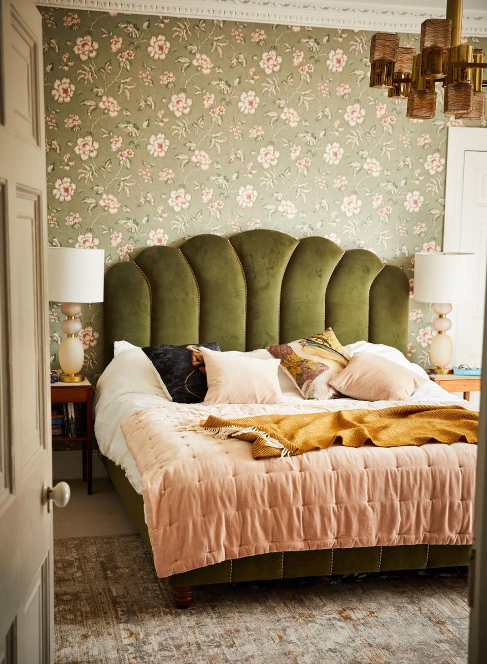 <p>"I went a bit maximalist with the textures and patterns in this room but that’s what I wanted - cosy elegance. The velvet bed is from <a href="https://go.redirectingat.com?id=127X1599956&url=https%3A%2F%2Fwww.sohohome.com%2F&sref=https%3A%2F%2Fwww.harpersbazaar.com%2Fuk%2Fculture%2Flifestyle_homes%2Fg33991640%2Finside-the-home-of-ruth-crilly%2F" rel="nofollow noopener" target="_blank" data-ylk="slk:Soho Home;elm:context_link;itc:0;sec:content-canvas" class="link ">Soho Home</a>, the wallpaper is by a brilliant brand called<a href="https://www.borastapeter.com/en" rel="nofollow noopener" target="_blank" data-ylk="slk:Borastapeter;elm:context_link;itc:0;sec:content-canvas" class="link "> Borastapeter </a>and the rug is<a href="https://www.louisdepoortere.be/" rel="nofollow noopener" target="_blank" data-ylk="slk:Louis de Poortere.;elm:context_link;itc:0;sec:content-canvas" class="link "> Louis de Poortere.</a> The big mid-century chandelier is Sciolari from a dealer in Italy. I get the majority of my vintage stuff from antiques dealers or through <a href="https://www.vinterior.co/" rel="nofollow noopener" target="_blank" data-ylk="slk:Vinterior;elm:context_link;itc:0;sec:content-canvas" class="link ">Vinterior</a>."</p>