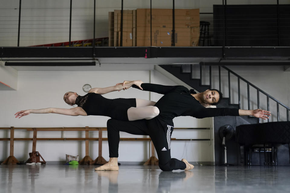Andrea Laššáková, left, and Adrian Blake Mitchell rehearse on Monday, April 18, 2022, in Santa Monica, Calif. The dancers left their positions at the Mikhailovsky Ballet Theatre in St. Petersburg and fled Russia ahead of the invasion of Ukraine. (AP Photo/Ashley Landis)