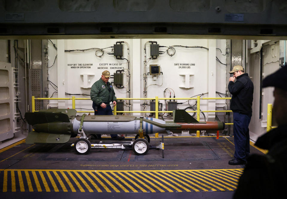 Crew members give a demonstration of the Advanced Weapon Elevator onboard the U.S. Aircraft Carrier USS Gerald R. Ford while anchored in the Solent near Gosport, Britain, November 17, 2022. REUTERS/Henry Nicholls