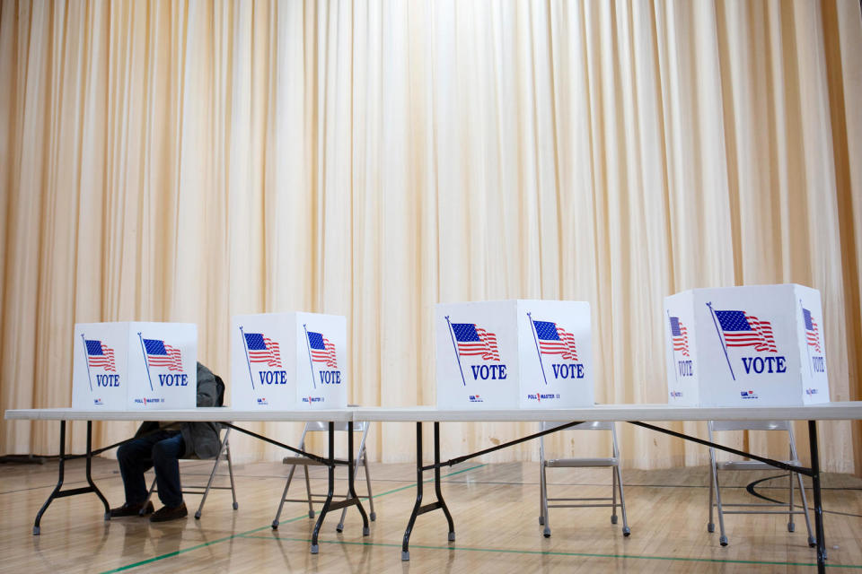 A voter casts his ballot in the New Hampshire primary in Laconia on Jan. 22. (Matt Nighswander / NBC News file)