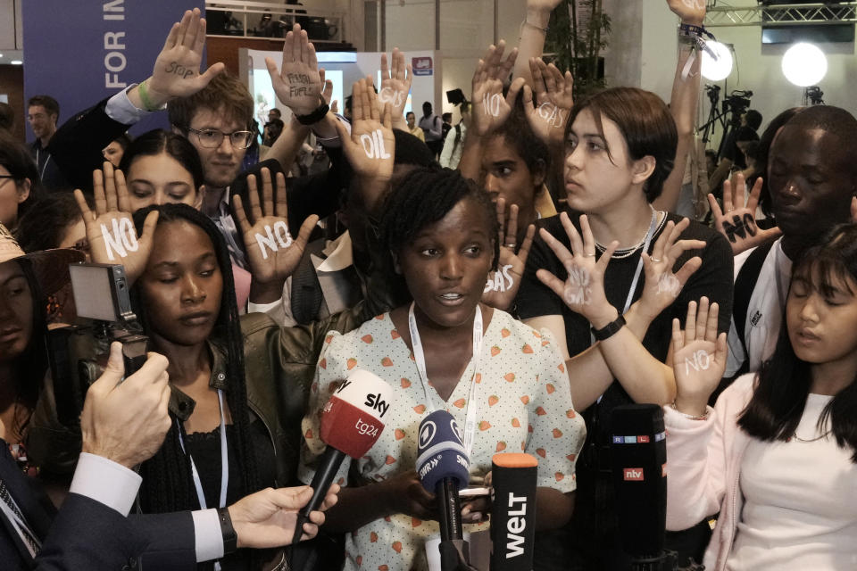 Climate activist Vanessa Nakate, of Uganda, is joined by others of Fridays for Future to protest against Germany's Olaf Scholz's climate policy at the COP27 U.N. Climate Summit, Tuesday, Nov. 8, 2022, in Sharm el-Sheikh, Egypt. (AP Photo/Nariman El-Mofty)